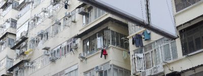 HongKong building, outside facade, balconies, laundry hanging outside.