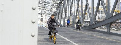 Shanghai bridge, street photography, Winter in Shanghai, Chinese man on a motorbike with winter outfit.