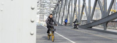 Shanghai bridge, street photography, Winter in Shanghai, Chinese man on a motorbike with winter outfit.